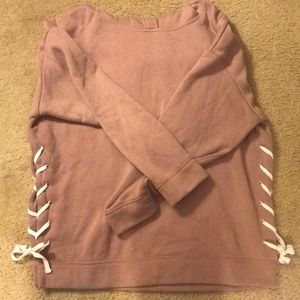 Blush pink hoodie with white lace-up detailing